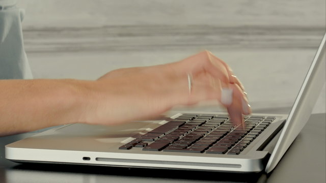 Hands of business woman with keyboard laptop