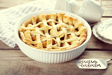 Homemade apple pie on wooden background