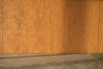 Orange concrete wall and floor texture and background.
