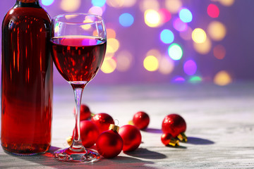Wine and Christmas decoration on bright background