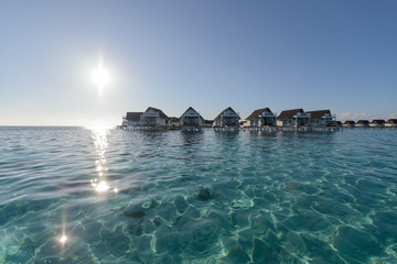 Wide angle of luxury over water bungalow, water villa lagoon in