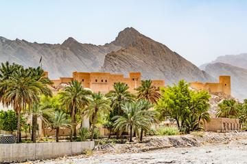 Nakhal Fort in the Al Batinah Region of Oman. It is located about 120 km to the west of Muscat, the capital of Oman. Nakhal town is known as the town of oasis. - obrazy, fototapety, plakaty