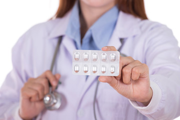 close up pills with female doctor