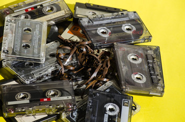old cassette tapes on colored background