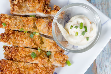 Japanese fried pork name is tonkatsu in white dish
