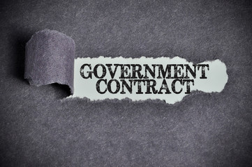 government contract word under torn black sugar paper - 94186797