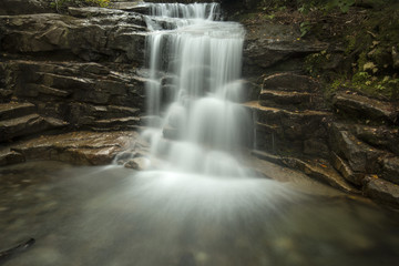 Silky water of Stairs Falls in Franconia Notch, New Hampshire.