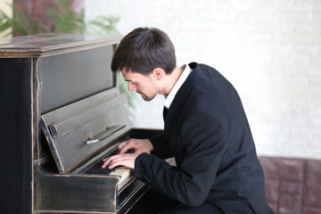 Musician plays piano