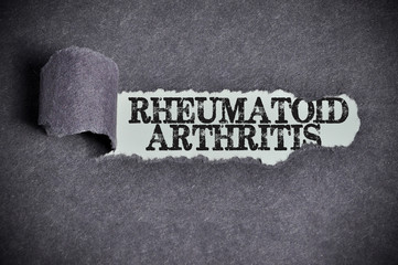 rheumatoid arthritis word under torn black sugar paper - 94187574
