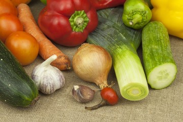 Fresh colorful vegetables on table. Fresh vegetables ready for processing. Kitchen table, ready for cooking vegetable dishes.

