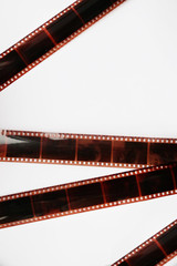 Camera film strips on white background