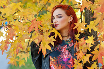 Naklejka na ściany i meble beautiful redhead girl in autumn scene