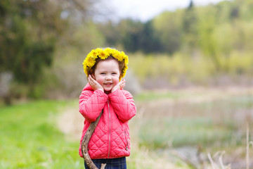 Pretty little girl relax at beauty summer landscape background