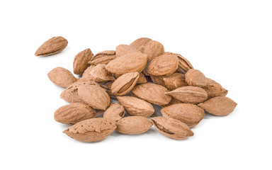 Heap almond nut closeup with shell on white