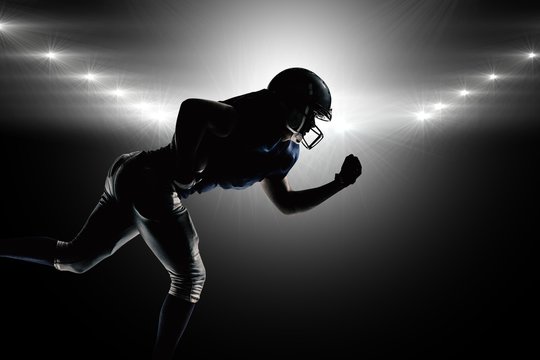 Composite image of silhouette american football player running