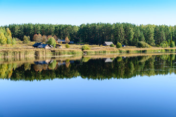 Fototapeta premium Colorful landscape with a abandoned village on the shore of fore