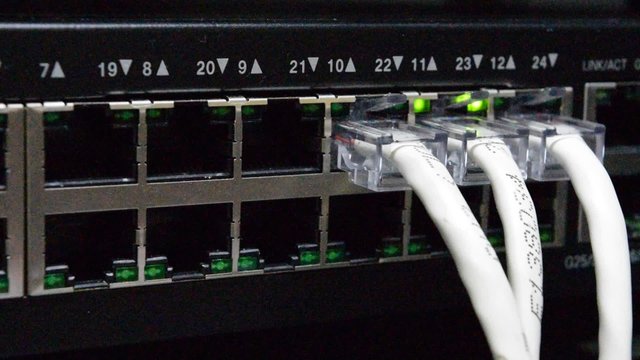 Network switch HUB and ethernet cables (LAN)  in datacenter