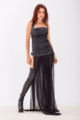 Gothic girl in leather dress and stockings