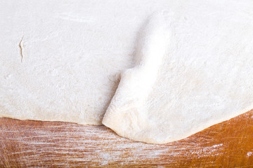 Process of preparing of lagman or pizza. Raw dough on old light