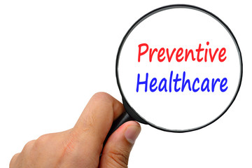preventive health care word. Magnifier and puzzles.