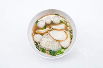 fish noodle in the bowl on the white background 