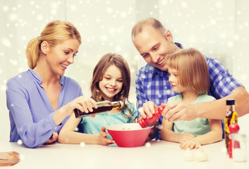 happy family with two kids making salad at home