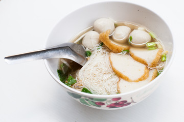 fish noodle in the bowl on the white background 