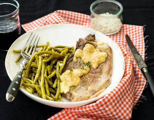 Pork chop with mustard sauce and green beans