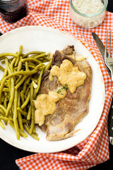 Pork chop with mustard sauce and green beans