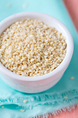 sesame seeds on wooden surface