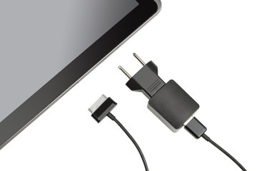 the discharged tablet with charger isolated on white background
