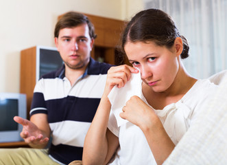 Woman crying after quarrelling with husband