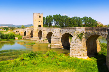 Fototapeta na wymiar View of medieval stone bridge over Ebro near Frias