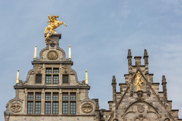 Fototapeta na wymiar Medieval houses with roof ornaments in Antwerp, Belgium
