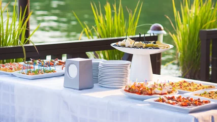 Fototapeten Catering buffet style with different light snack © Oakozhan