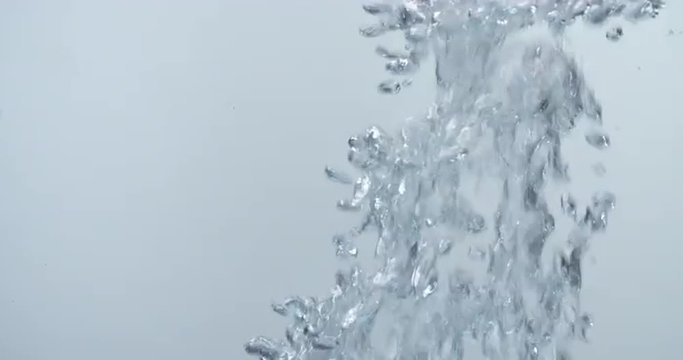 air bubbles rise up in water, like boiling