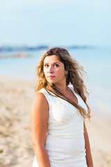 Fototapeta na wymiar young woman on the beach