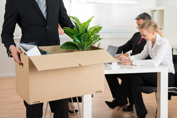 Businessman Carrying Personal Belongings