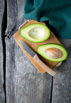 avocado on wooden surface