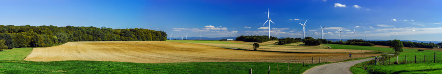 Fototapeta premium Wind turbine generating electricity in a beautiful valley