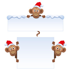 Smiley monkey head in Christmas red hat peeking from behind a