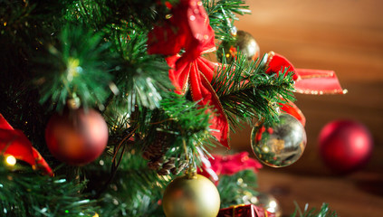 close up of christmas tree decorated with balls