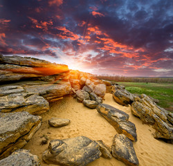 Stones desert on sunset background