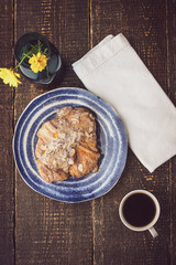 Cup of coffee with croissant  and flower top view