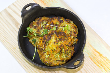 vegetable fritters on an iron skillet