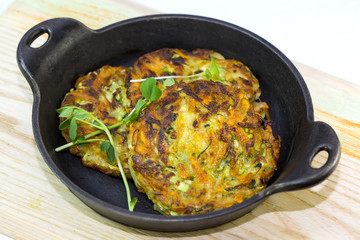 vegetable fritters on an iron skillet