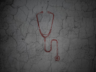 Medicine concept: Stethoscope on grunge wall background