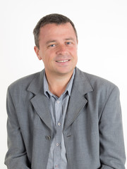 Attractive smiling man relaxing isolated on white background