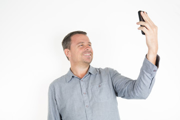 Modern man doing a self-portrait on the phone