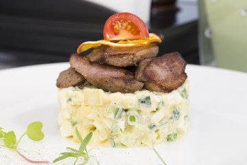 salad with meat on a table in a restaurant